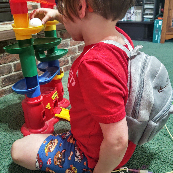 side view of Plush Small Backpack