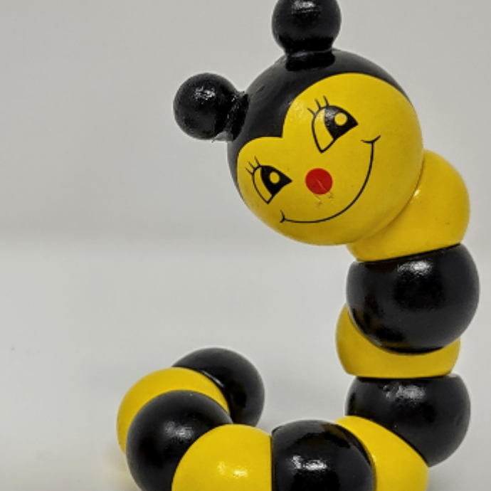 yellow and black wooden caterpillar