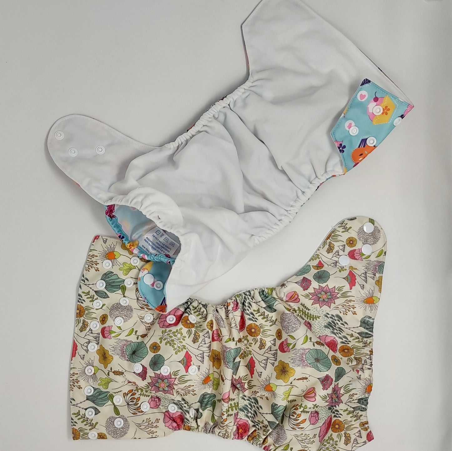 photo showing both sides of the cloth reusable diaper