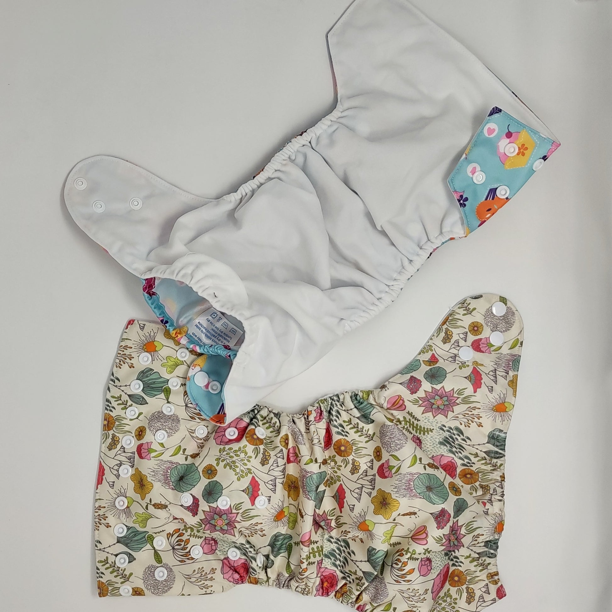 photo showing both sides of the cloth reusable diaper
