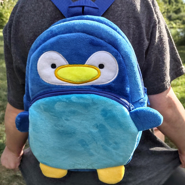 Small Plush Penguin Children's Backpack on Child